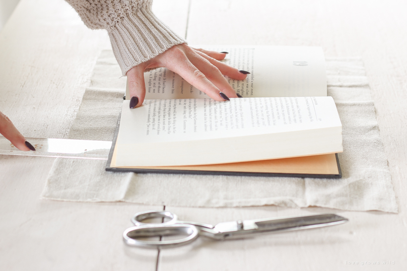 How to cover books in a beautifully distressed canvas fabric to use for styling shelves and tables.