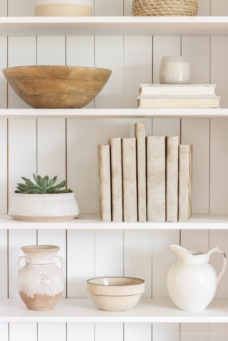 How to cover books in a beautifully distressed canvas fabric to use for styling shelves and tables.