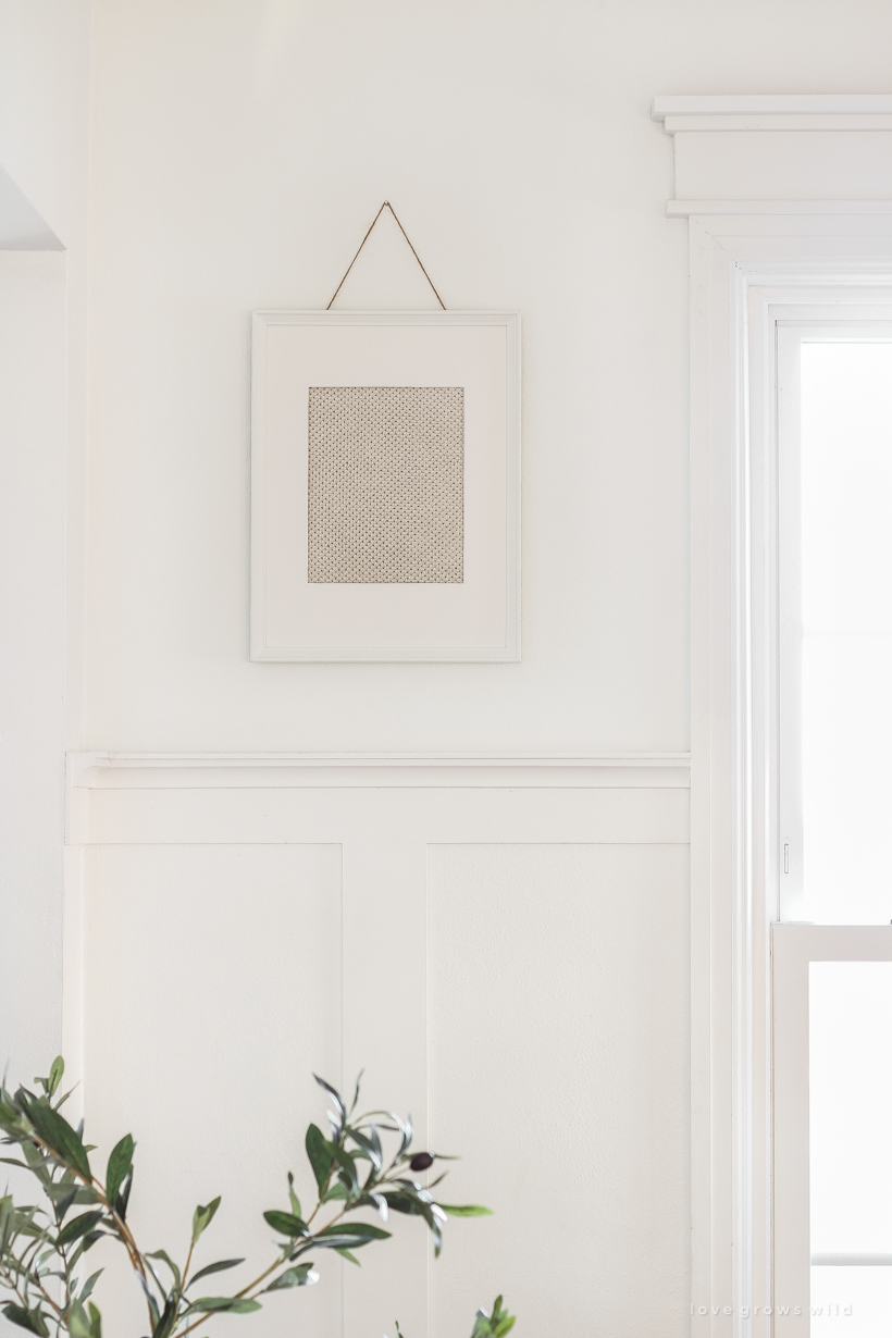 Decorating tip: Frame a scrap piece of fabric for a simple and inexpensive piece of artwork. Home + lifestyle blogger Liz Fourez shares her advice for the best fabric options to use.
