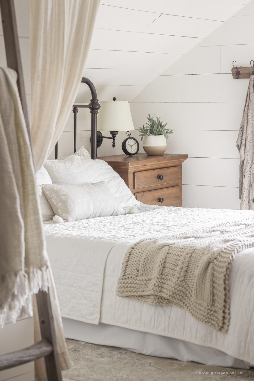 A new rug, curtains, bedding and artwork in designer Liz Fourez's beautifully cozy master bedroom