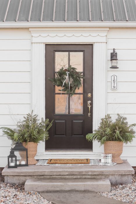 Interior decorator and home blogger Liz Fourez shares how to make these beautiful winter planters for the holidays with fresh or faux greens!