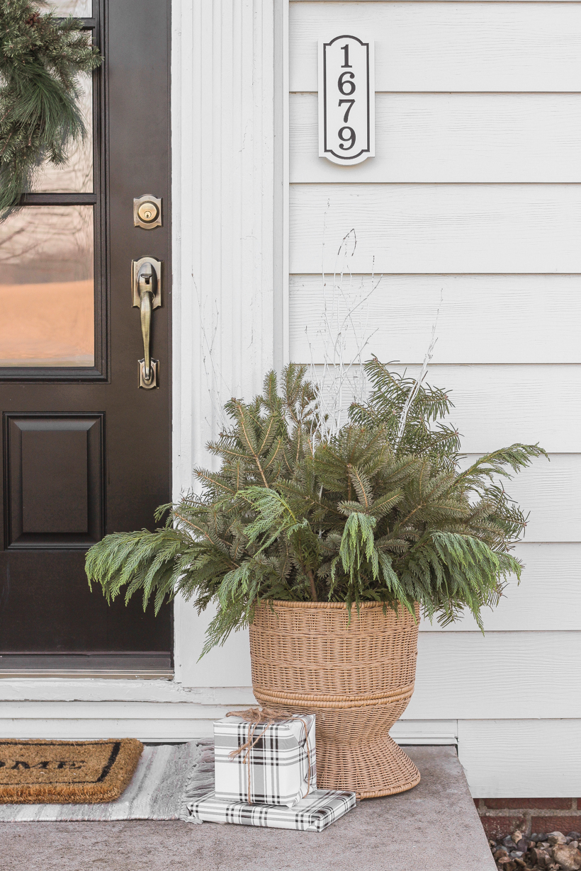 Interior decorator and home blogger Liz Fourez shares how to make these beautiful winter planters for the holidays with fresh or faux greens! 