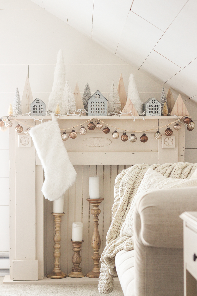 Interior decorator and home blogger Liz Fourez shares her beautiful mantel decorated for Christmas. Find out how you can build this exact mantel on LoveGrowsWild.com