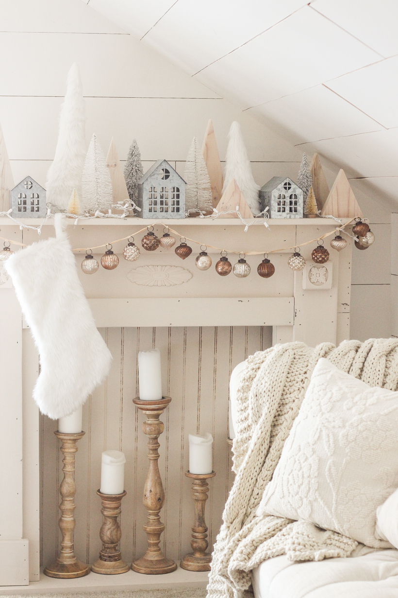 Interior decorator and home blogger Liz Fourez shares her beautiful mantel decorated for Christmas. Find out how you can build this exact mantel on LoveGrowsWild.com