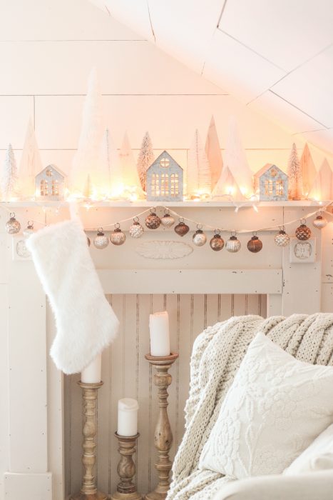Interior decorator and home blogger Liz Fourez shares her beautiful mantel decorated for Christmas. Find out how you can build this exact mantel on LoveGrowsWild.com