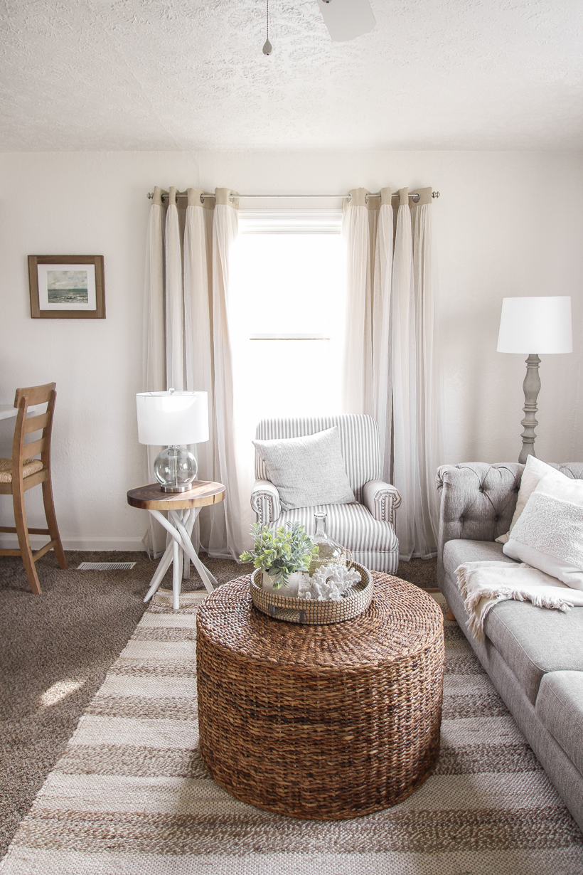 A small rental home decorated in a cozy beachy cottage style on a budget! Get all the details from home blogger and interior decorator Liz Fourez of lovegrowswild.com