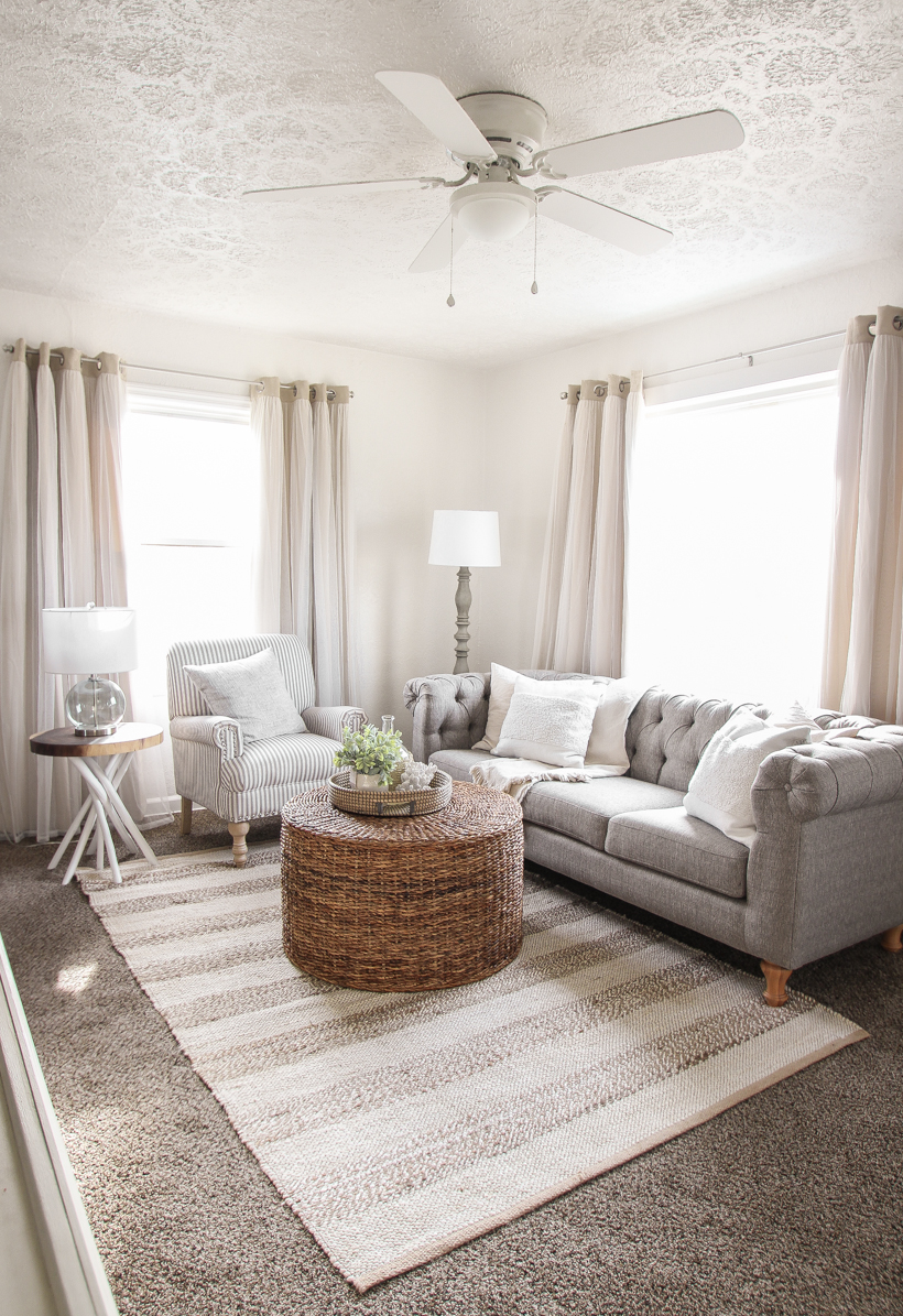 A small rental home decorated in a cozy beachy cottage style on a budget! Get all the details from home blogger and interior decorator Liz Fourez of lovegrowswild.com