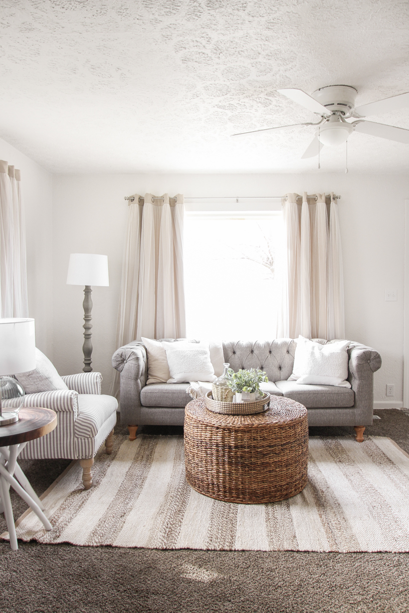 A small rental home decorated in a cozy beachy cottage style on a budget! Get all the details from home blogger and interior decorator Liz Fourez of lovegrowswild.com