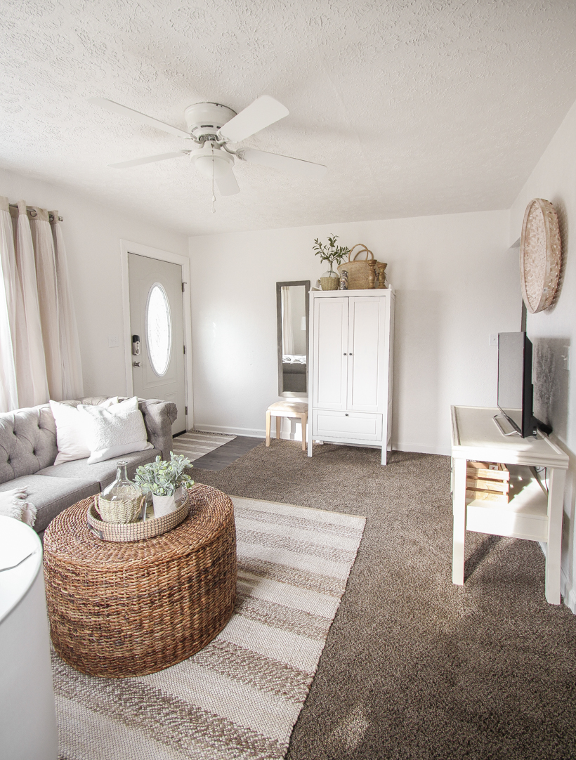 A small rental home decorated in a cozy beachy cottage style on a budget! Get all the details from home blogger and interior decorator Liz Fourez of lovegrowswild.com