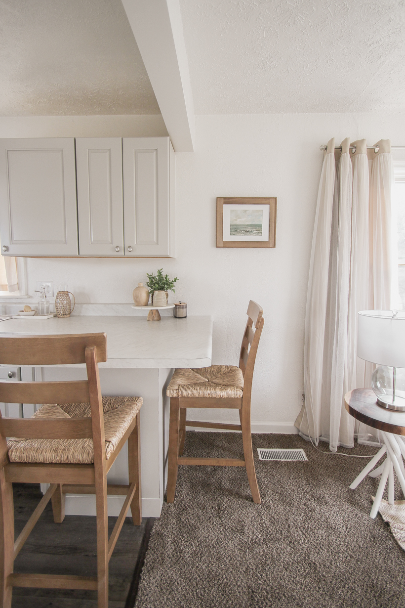 A small rental home decorated in a cozy beachy cottage style on a budget! Get all the details from home blogger and interior decorator Liz Fourez