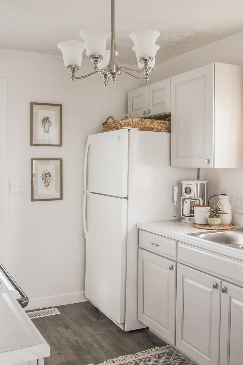 A small rental home decorated in a cozy beachy cottage style on a budget! Get all the details from home blogger and interior decorator Liz Fourez