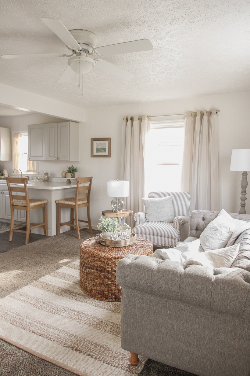 A small rental home decorated in a cozy beachy cottage style on a budget! Get all the details from home blogger and interior decorator Liz Fourez