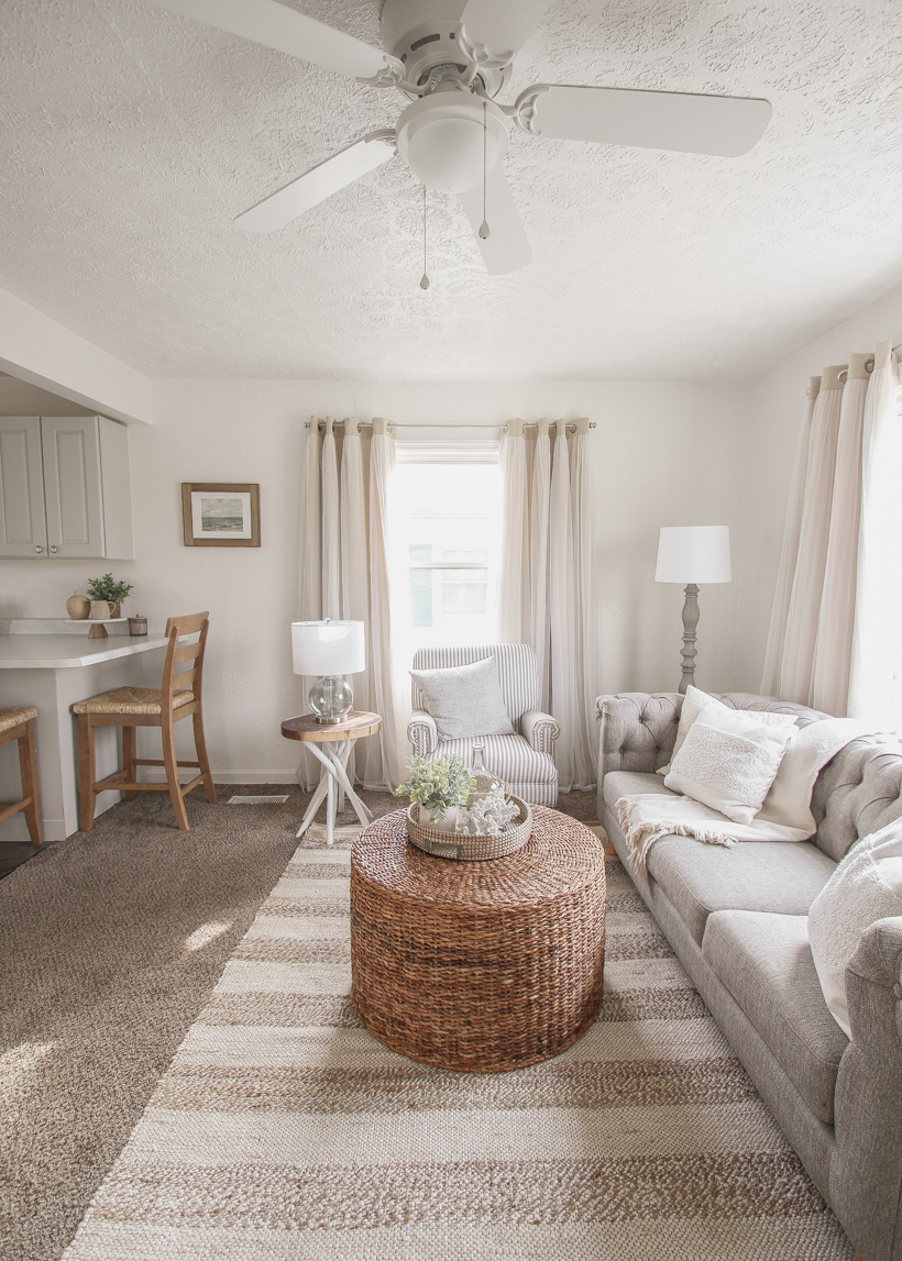 A small rental home decorated in a cozy beachy cottage style on a budget! Get all the details from home blogger and interior decorator Liz Fourez