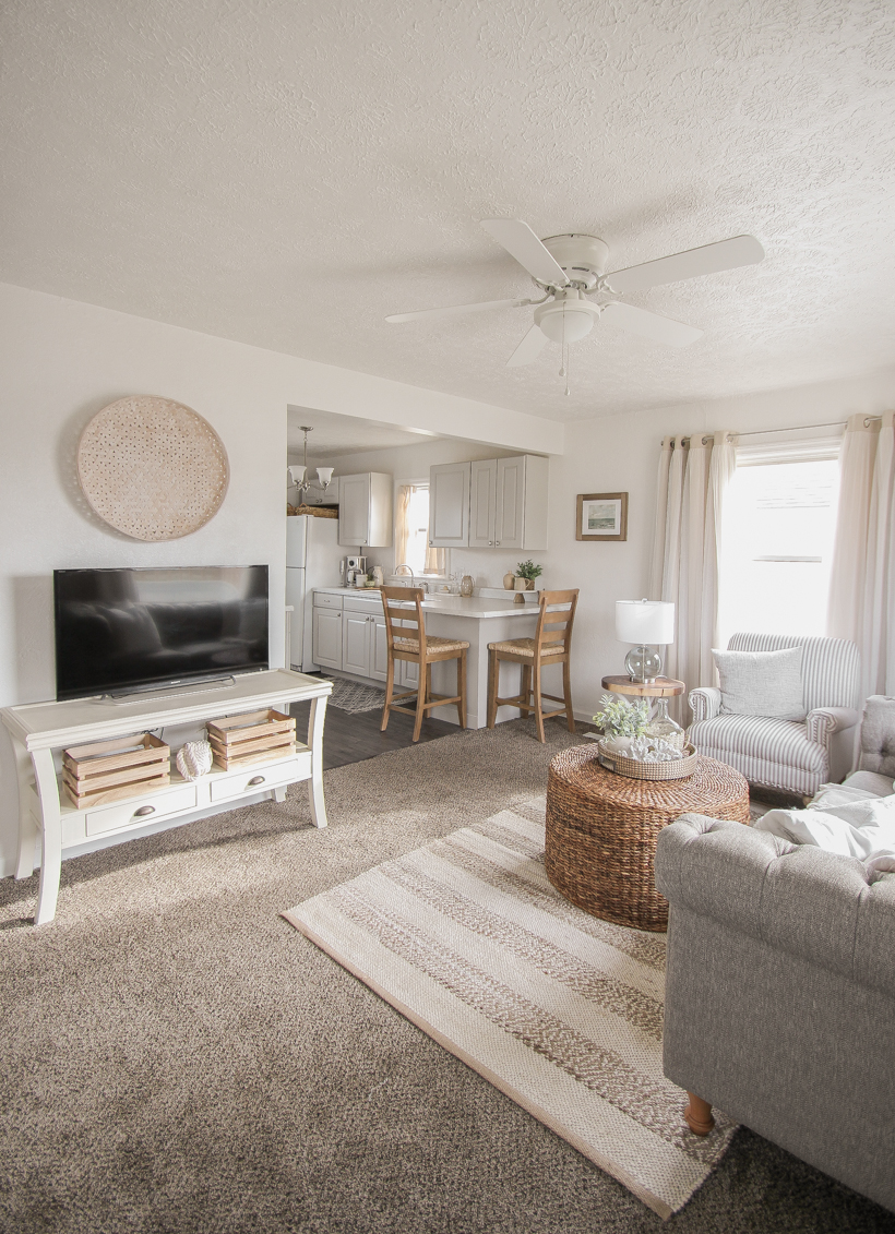 A small rental home decorated in a cozy beachy cottage style on a budget! Get all the details from home blogger and interior decorator Liz Fourez