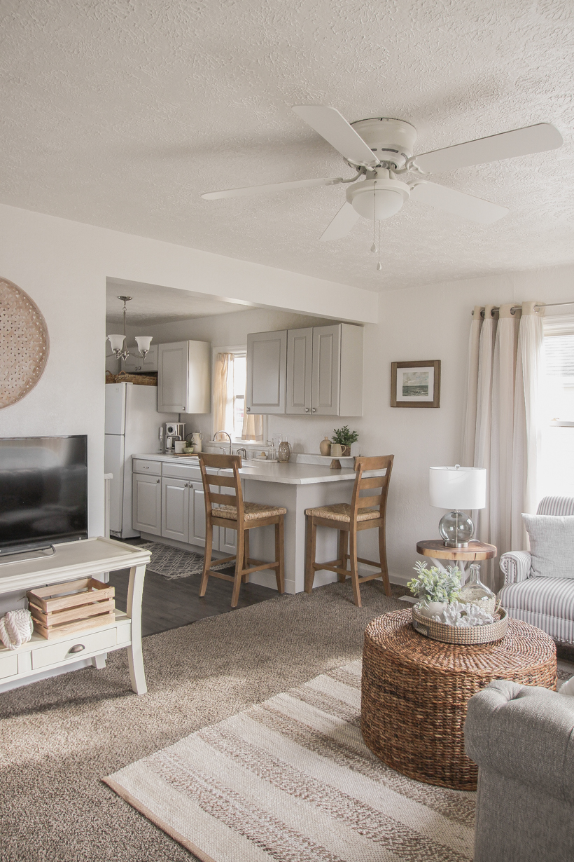 A small rental home decorated in a cozy beachy cottage style on a budget! Get all the details from home blogger and interior decorator Liz Fourez