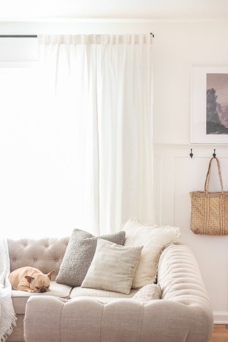 The best way to hang curtains to make your windows appear larger and more luxurious! See tips from home blogger and interior decorator Liz Fourez of LoveGrowsWild.com