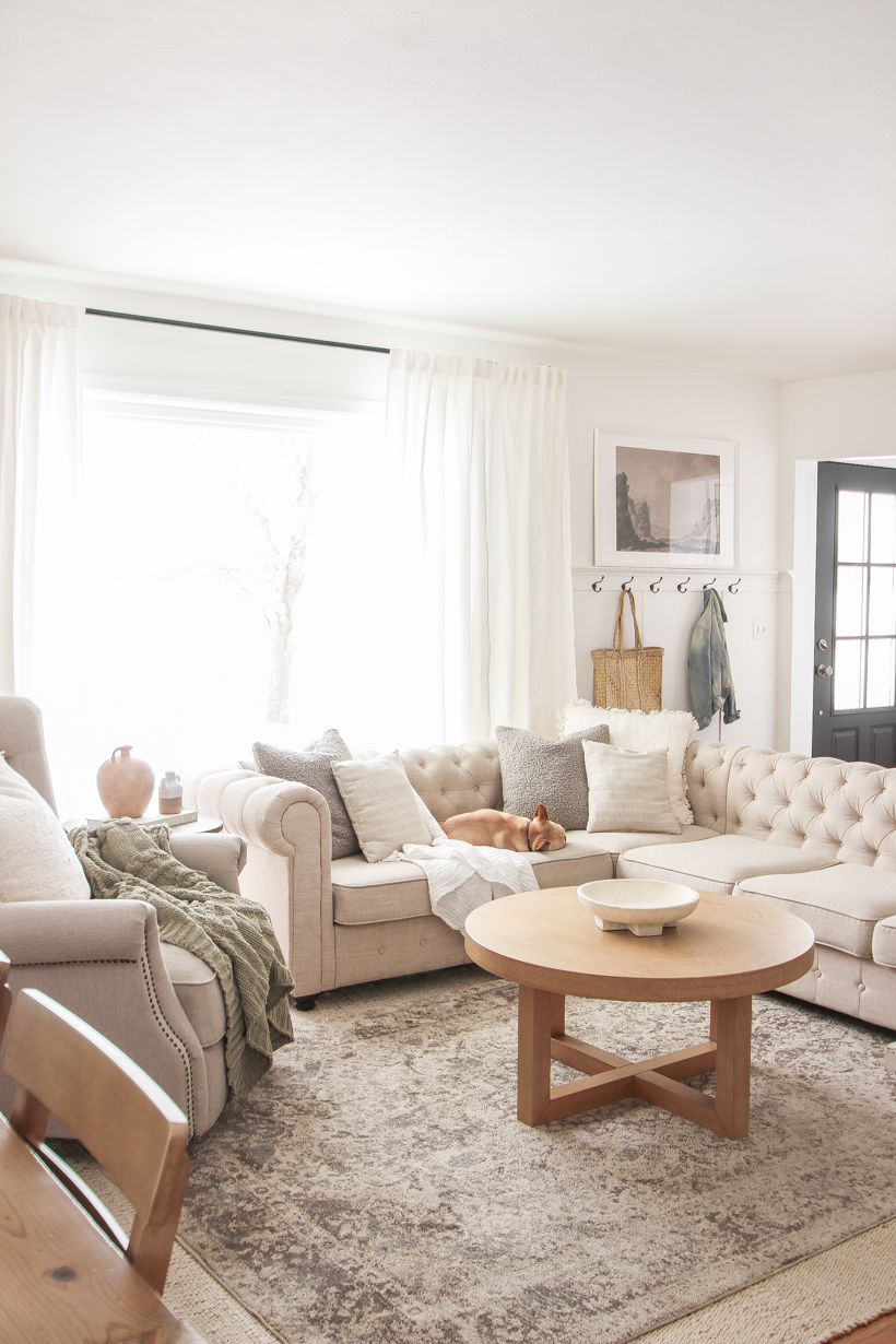 The best way to hang curtains to make your windows appear larger and more luxurious! See tips from home blogger and interior decorator Liz Fourez of LoveGrowsWild.com