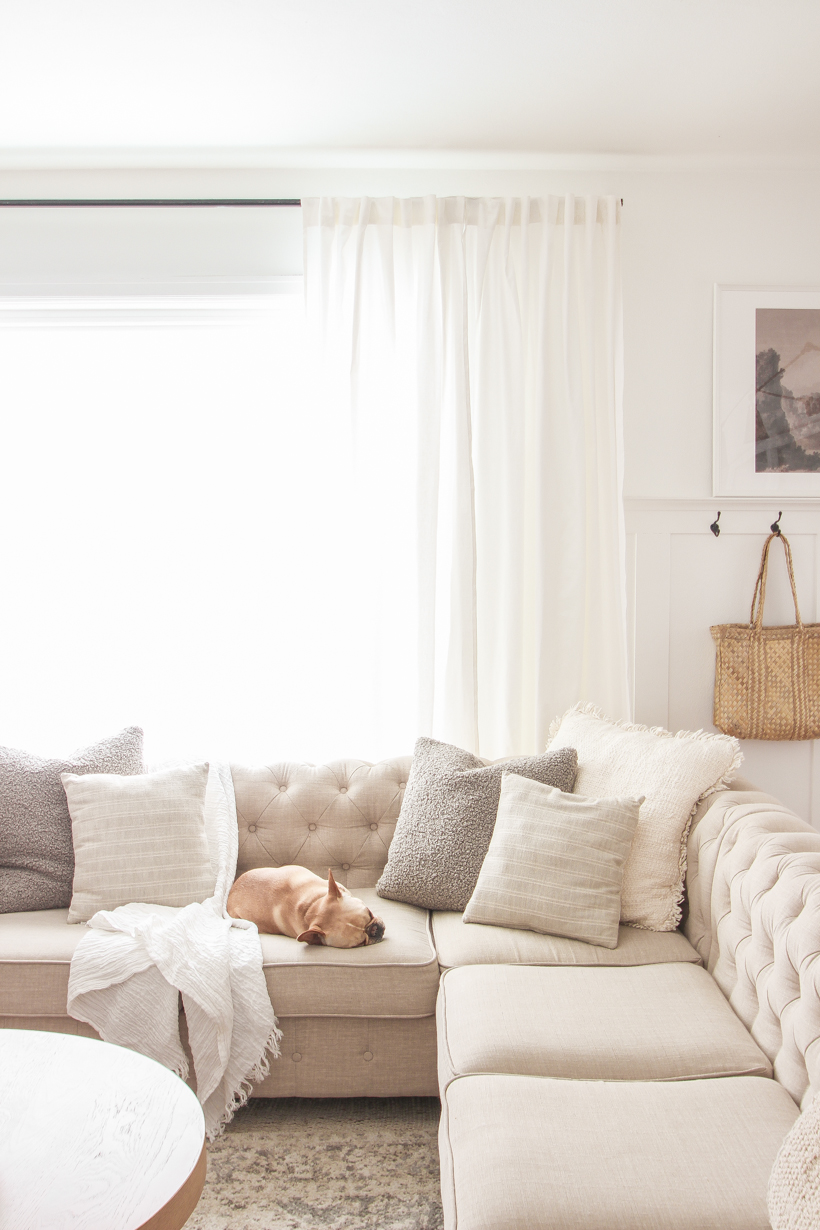 The best way to hang curtains to make your windows appear larger and more luxurious! See tips from home blogger and interior decorator Liz Fourez of LoveGrowsWild.com