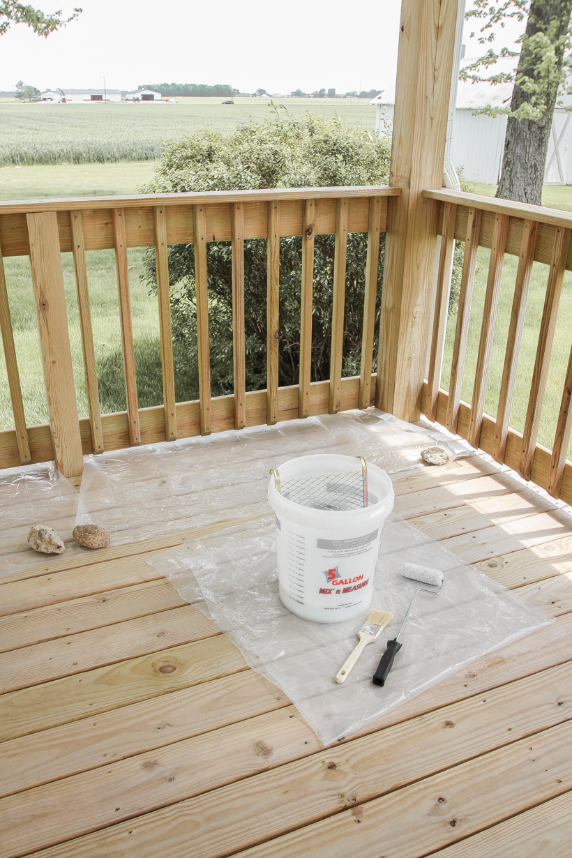 Interior decorator and home blogger Liz Fourez shares everything you need to know about staining a deck from prep to finish!