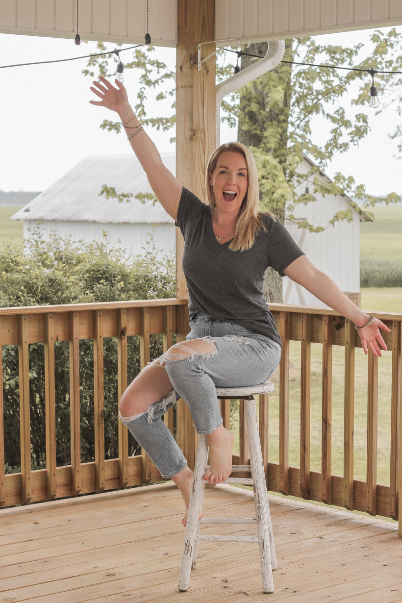 Interior decorator and home blogger Liz Fourez shares everything you need to know about staining a deck from prep to finish!