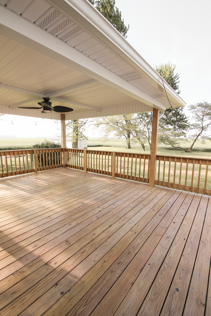 Interior decorator and home blogger Liz Fourez shares everything you need to know about staining a deck from prep to finish!