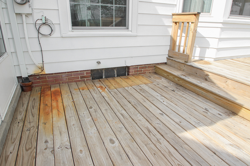 Interior decorator and home blogger Liz Fourez shares everything you need to know about staining a deck from prep to finish!