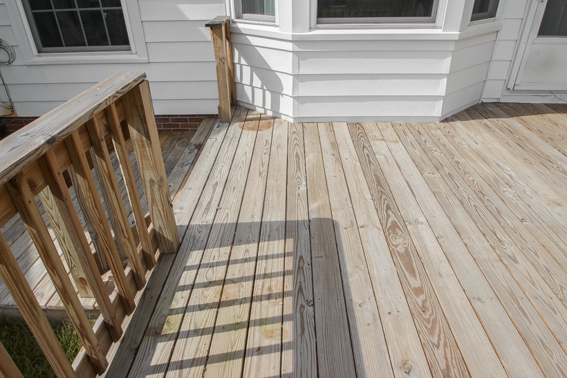 Interior decorator and home blogger Liz Fourez shares everything you need to know about staining a deck from prep to finish!