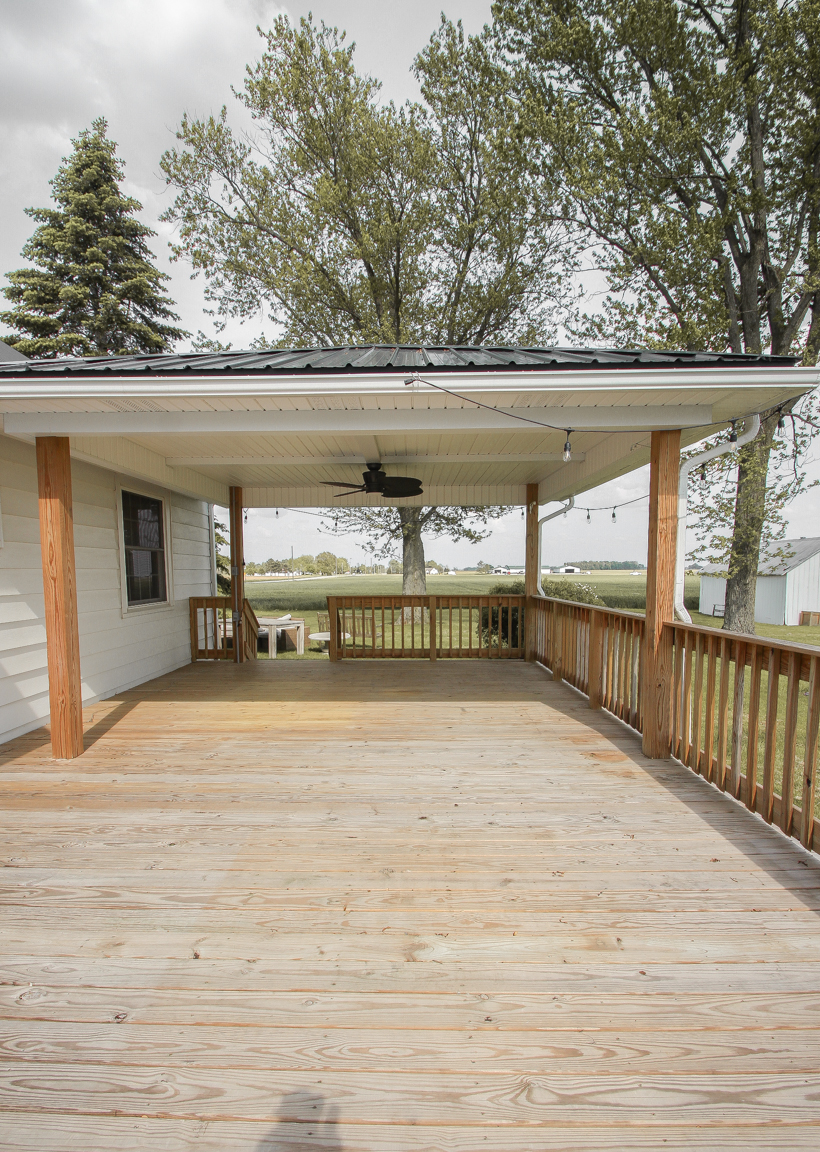 Interior decorator and home blogger Liz Fourez shares everything you need to know about staining a deck from prep to finish!