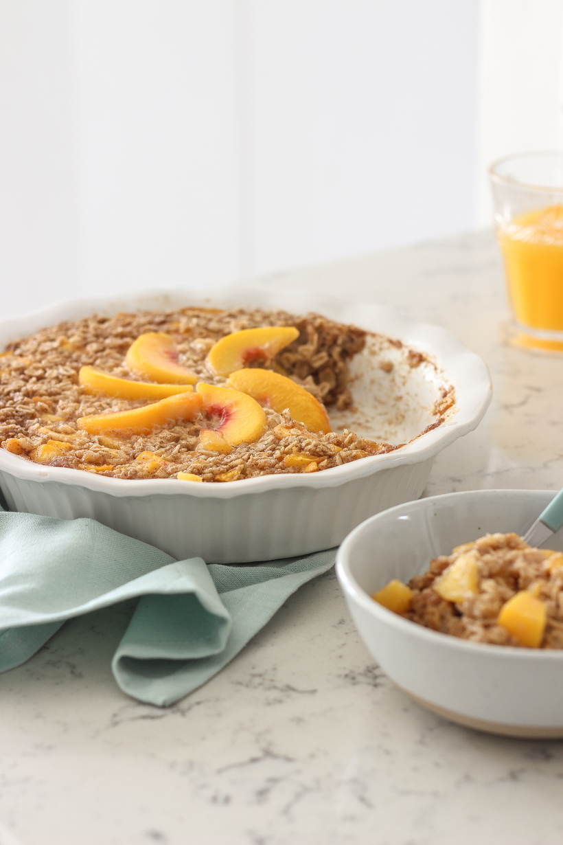 Blogger Liz Fourez of LoveGrowsWild.com shares a delicious peach baked oatmeal that is perfect for brunch or prepping a healthy breakfast for the week ahead.