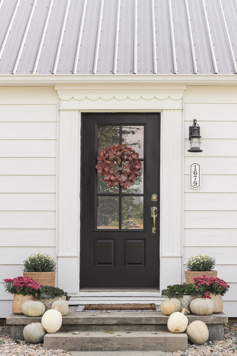 Home blogger and interior decorator Liz Fourez shares her small front porch decorated for fall with the perfect mix of soft neutrals and subtle color.