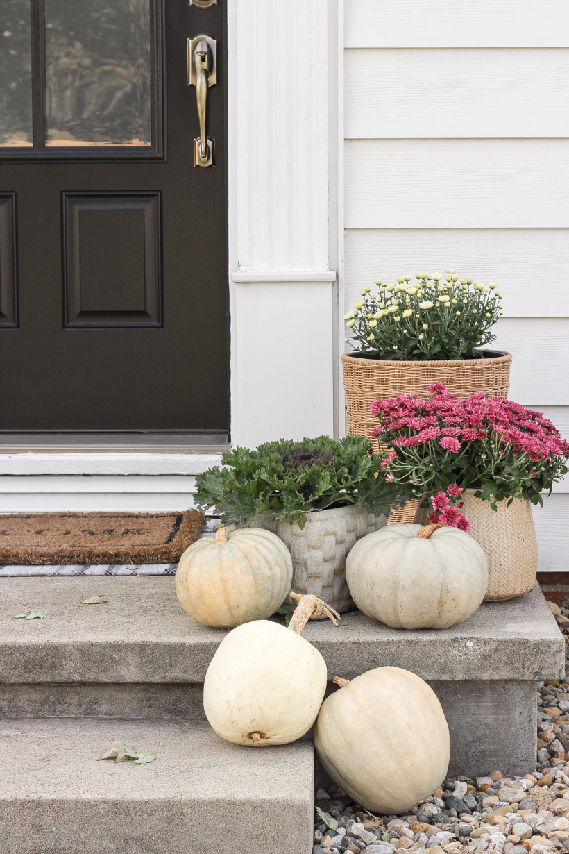 Home blogger and interior decorator Liz Fourez shares her small front porch decorated for fall with the perfect mix of soft neutrals and subtle color.