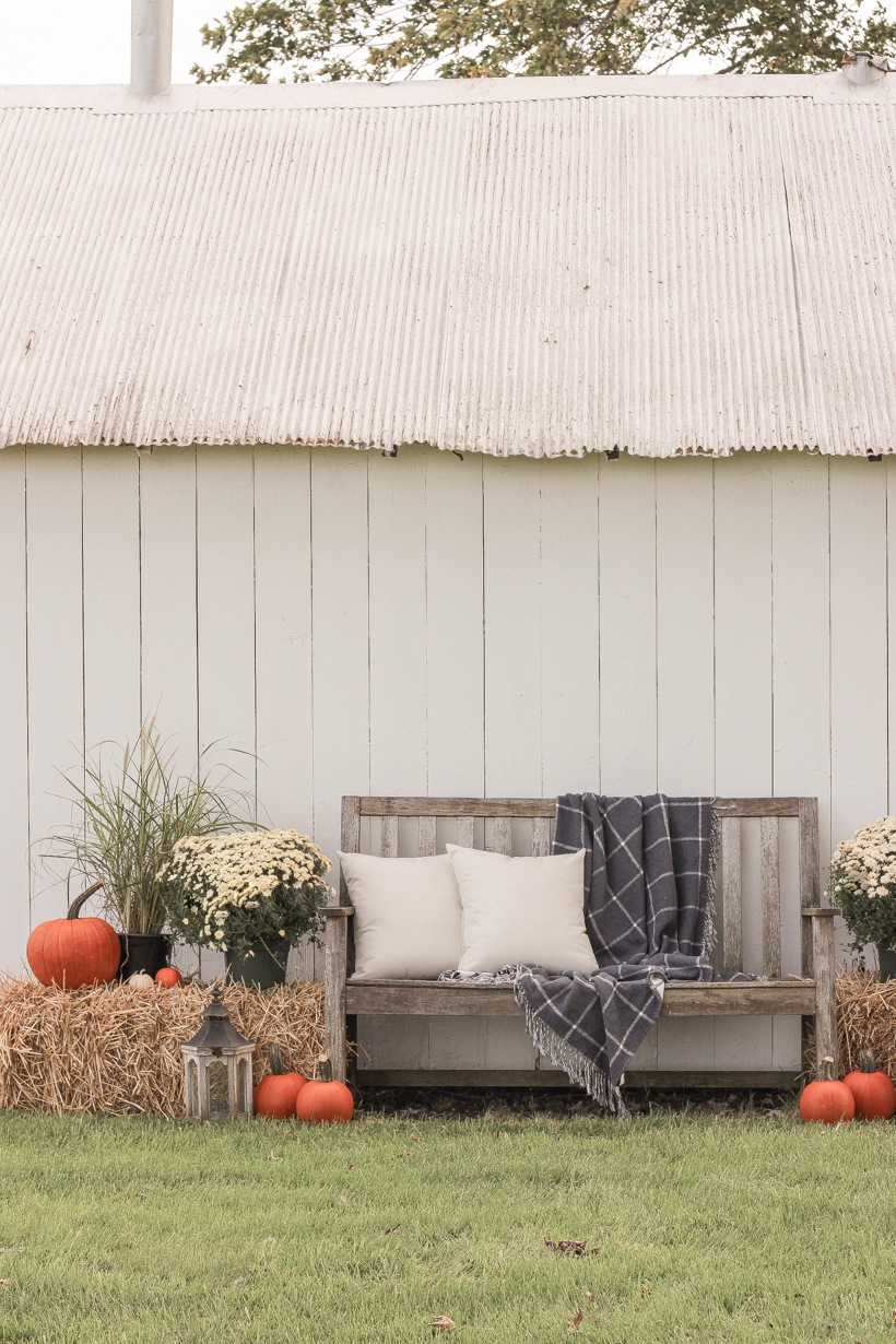 Home blogger and interior decorator Liz Fourez shares easy ideas for outdoor fall decorating on the cutest little barn