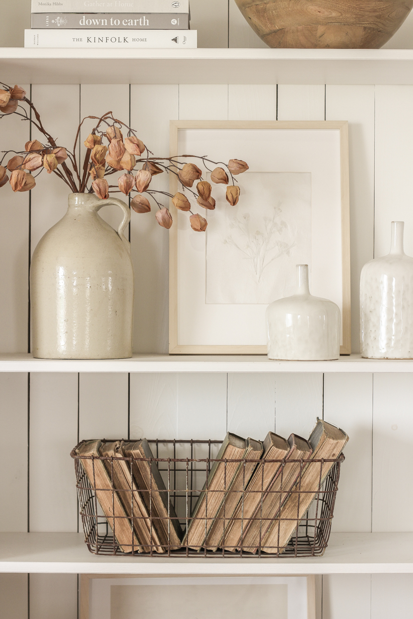 Simple fall decor with pops of burgundy and lots of cozy textures in the home of blogger and interior decorator Liz Fourez