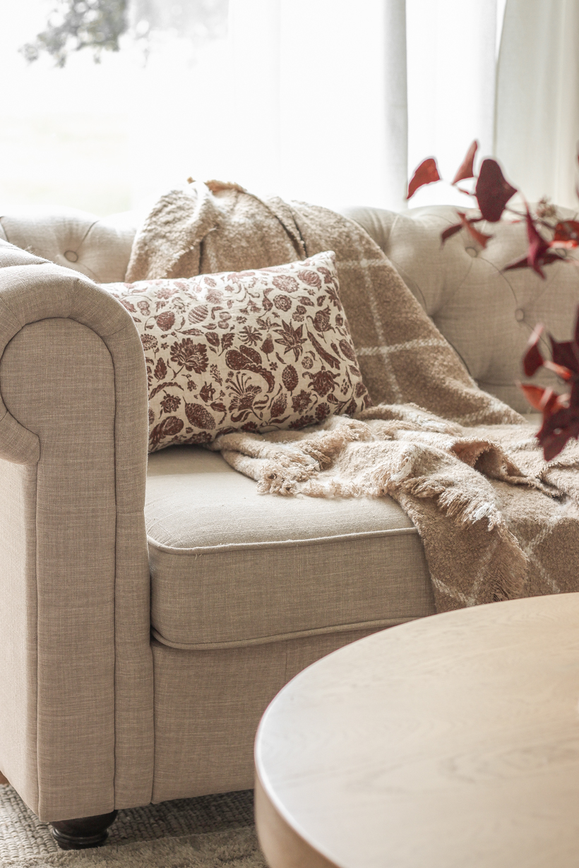 Simple fall decor with pops of burgundy and lots of cozy textures in the home of blogger and interior decorator Liz Fourez