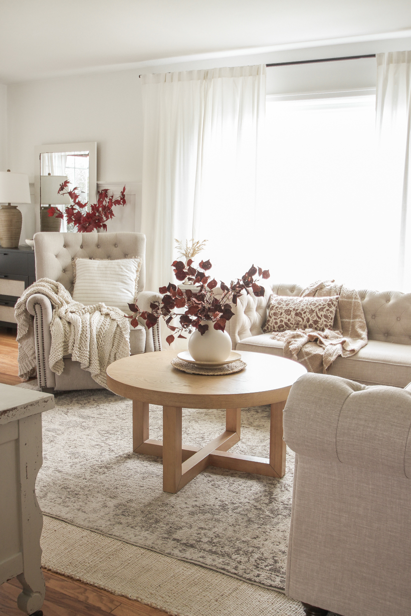 Simple fall decor with pops of burgundy and lots of cozy textures in the home of blogger and interior decorator Liz Fourez