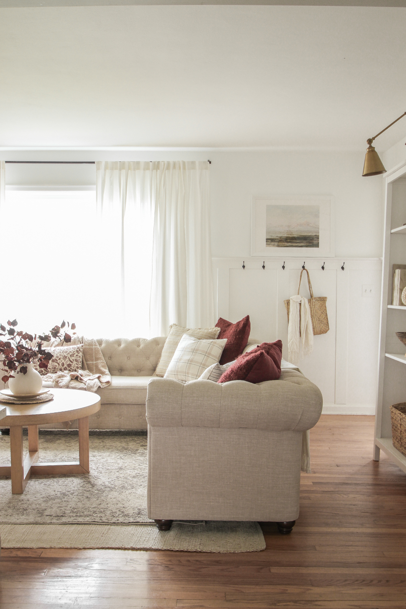 Simple fall decor with pops of burgundy and lots of cozy textures in the home of blogger and interior decorator Liz Fourez