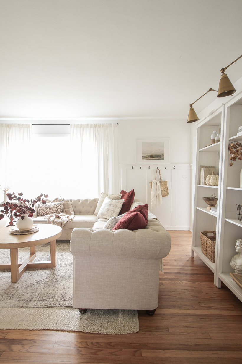 Simple fall decor with pops of burgundy and lots of cozy textures in the home of blogger and interior decorator Liz Fourez