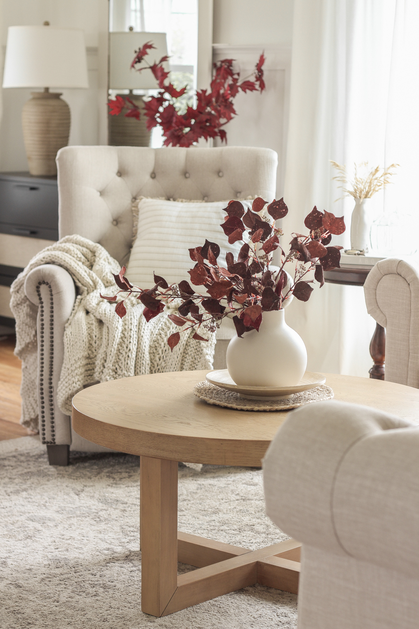 Simple fall decor with pops of burgundy and lots of cozy textures in the home of blogger and interior decorator Liz Fourez