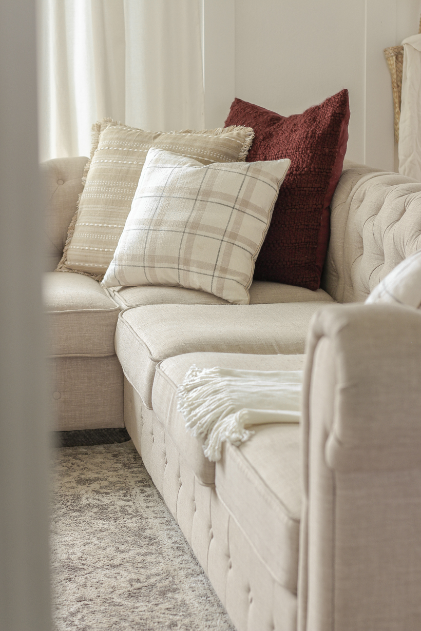 Simple fall decor with pops of burgundy and lots of cozy textures in the home of blogger and interior decorator Liz Fourez