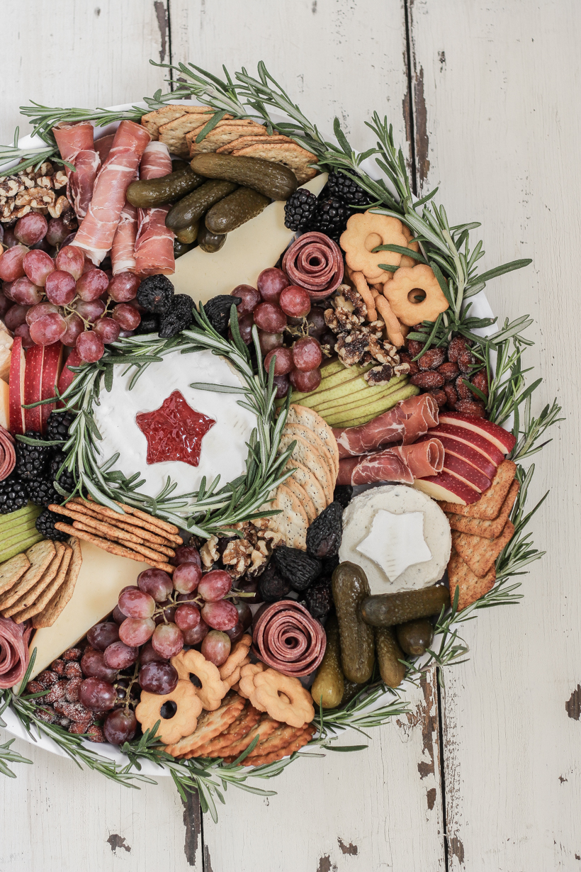 Learn how to make this stunning Wreath Charcuterie Board for your next holiday gathering from home blogger Liz Fourez of Love Grows Wild