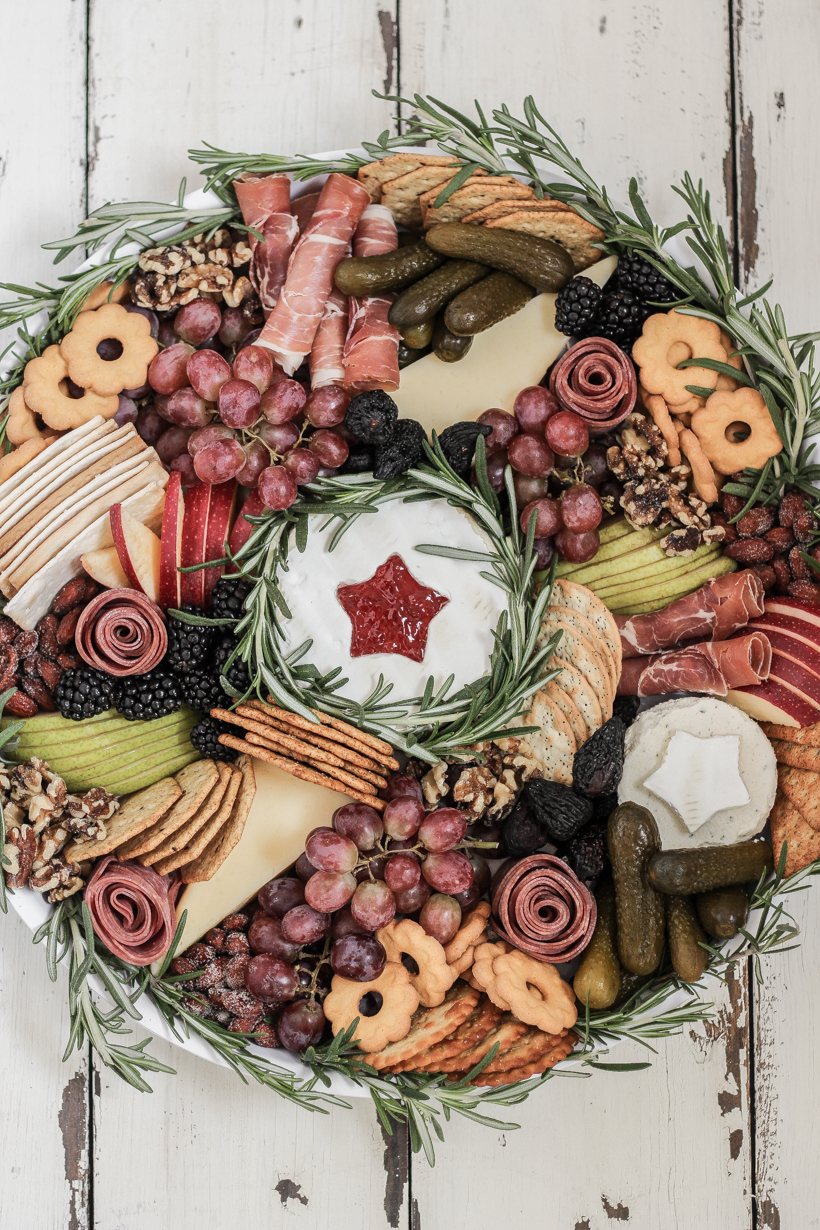 Learn how to make this stunning Wreath Charcuterie Board for your next holiday gathering from home blogger Liz Fourez of Love Grows Wild