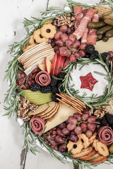 Learn how to make this stunning Wreath Charcuterie Board for your next holiday gathering from home blogger Liz Fourez of Love Grows Wild
