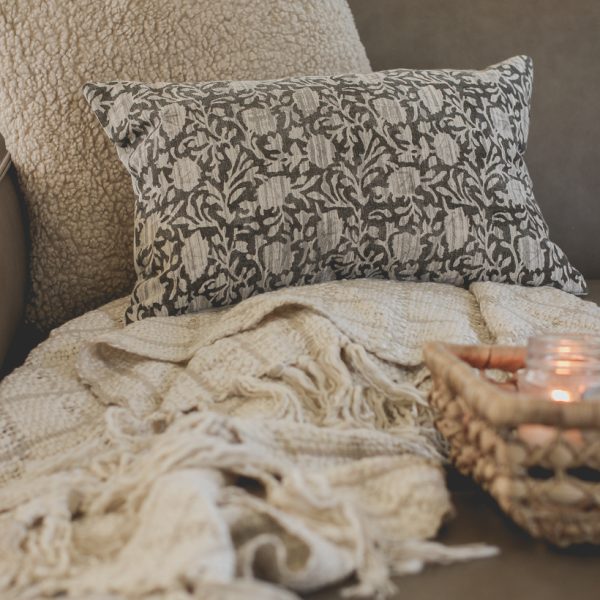 The prettiest throw pillows and blankets for fall that will instantly cozy up your home - curated by home blogger and interior decorator Liz Fourez