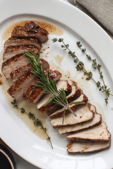 Easy oven roasted pork tenderloin topped with the most delicious balsamic glaze