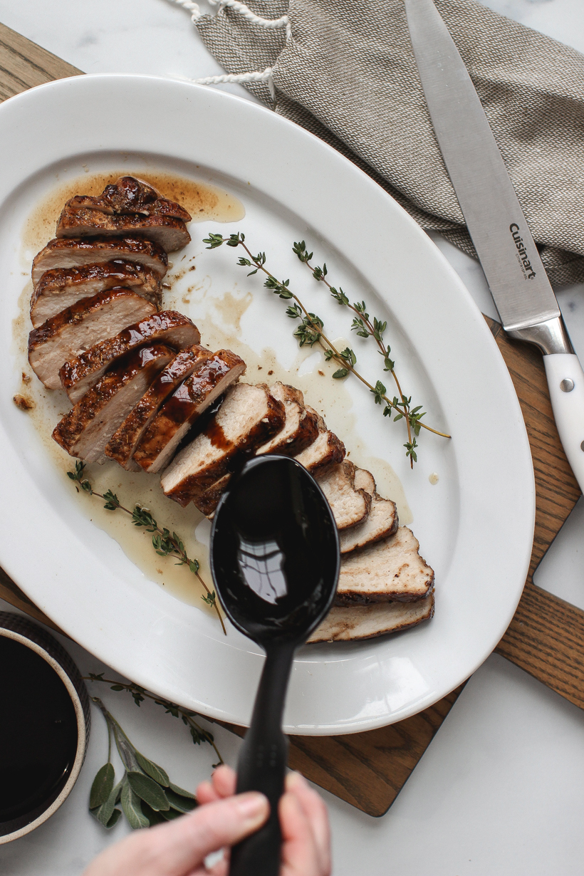Easy oven roasted pork tenderloin topped with the most delicious balsamic glaze