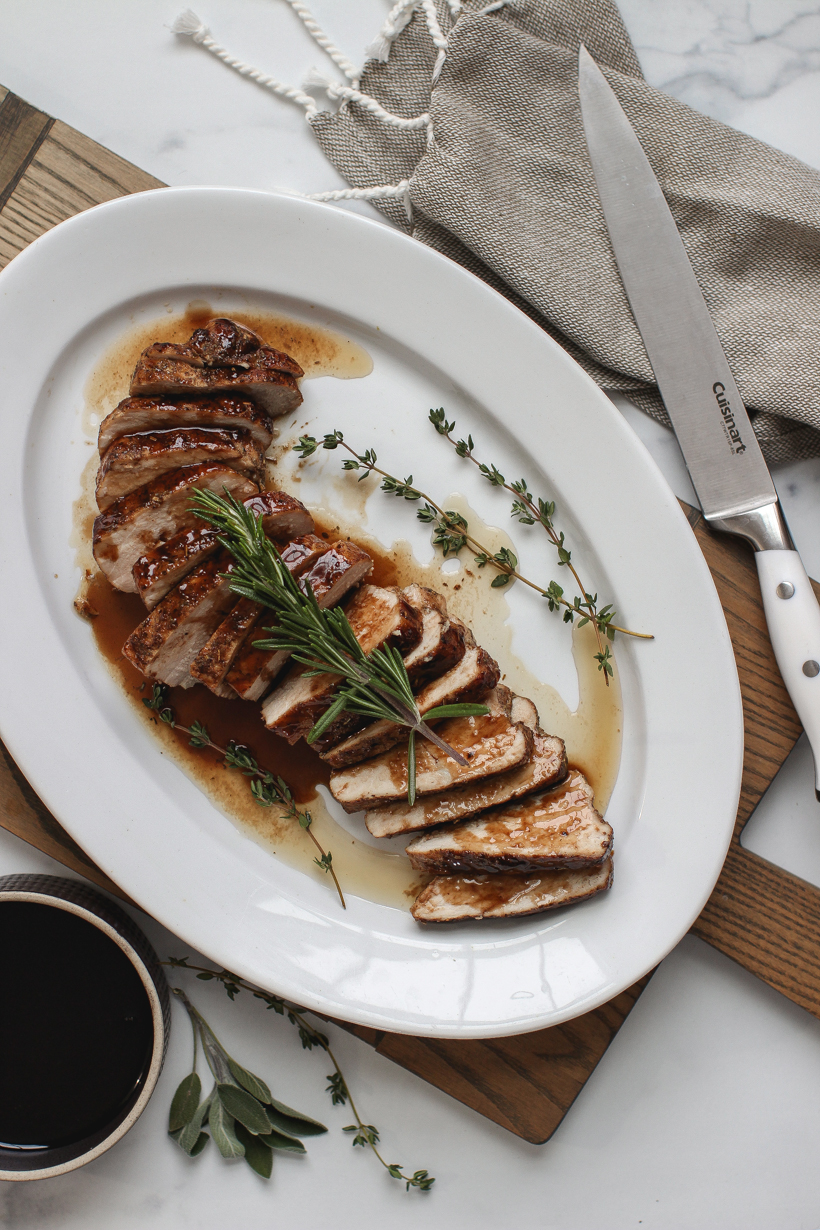 Easy oven roasted pork tenderloin topped with the most delicious balsamic glaze