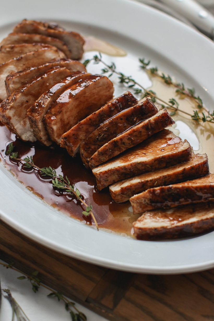 Easy oven roasted pork tenderloin topped with the most delicious balsamic glaze